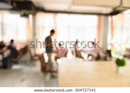 abstract blurred people in coffee shop