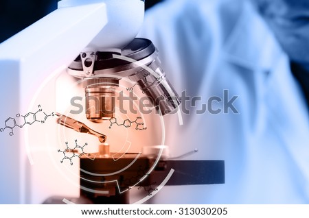 Scientist  dropping chemical liquid to microscope with chemical equations, Laboratory research concept