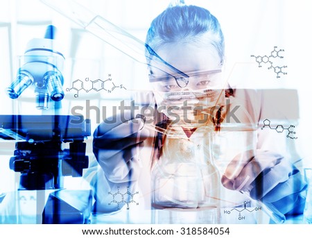 female medical or scientific researcher or woman doctor looking at a test tube of clear solution in a laboratory with her microscope beside her;Double exposure style