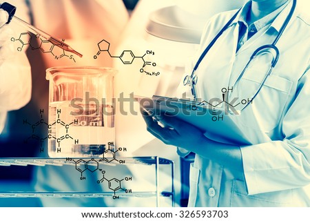 scientist writing report with equipment and science experiments.with chemical equations,Laboratory research concept