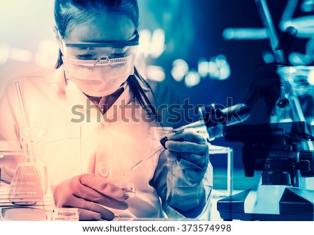 scientist with equipment and science experiments,Laboratory glassware containing chemical liquid, science research