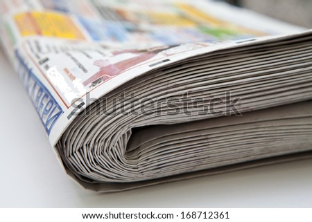 Stack of folded newspapers close-up