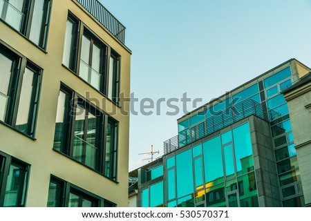 tow big office buildings with glass facade
