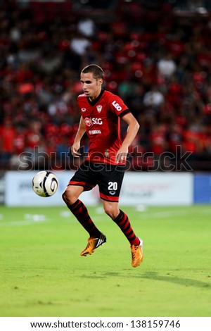 NONTHABURI THAI-May11:Mario Gjurovski of SCG Muangthong Utd.contols the ball during Thai Premier League 2013 between SCG Muangthong Utd.and Insee Police UTD.at SCG Stadium on May11,2013 in,Thailand