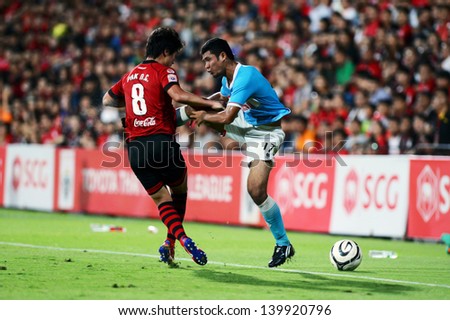 NONTHABURI THAI-MAY26:Pak Nam-Chol(R)of SCG Muangthong.in action durig a friendly match Thai Premier League between SCG Muangthong Utd.and Samut Songkhram F.C.at SCG Stadium on May26,2013 in,Thailand
