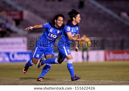 BANGKOK,THAILAND-AUG21:Suphasek Kaikaew#10 of BGFC congratulated by team mates during Thai Premier League between Army United and Bangkok Glass FC at Army stadium on AUGUST21,2013in Bangkok,Thailand.