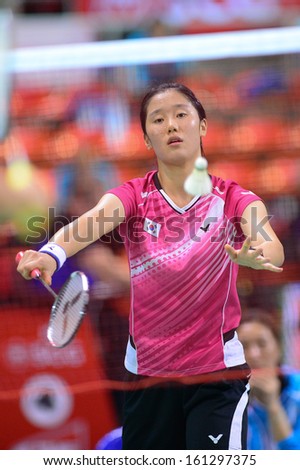 BKK,THA-OCT30:Min Ji Lee of Korea to serve during Chisato Hoshi of Japan badminton SCG BWF World Junior Championships2013at Indoor national stadium Hun-Mak on October30,2013 in Bangkok,Thailand