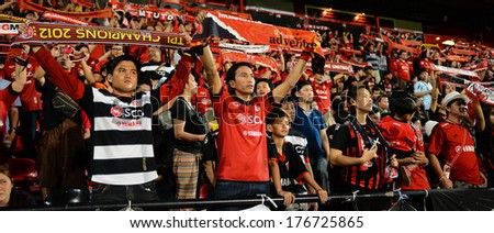 NONTHABURI-FEB 8,Hull fans raise scarves with the message during football AFC Champions League 2014 between SCG Muangthong utd and Hanoi T&T at SCG Stadium on February8,2014 in Thailand