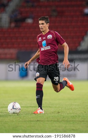 PATHUMTHANI THAILAND-MAY 05:Sergio Suarez of Police Utd. run with the ball during  Thai Premier League match between Police Utd.and Songkhla Utd.at Thammasat Stadium on May 05,2014,Thailand