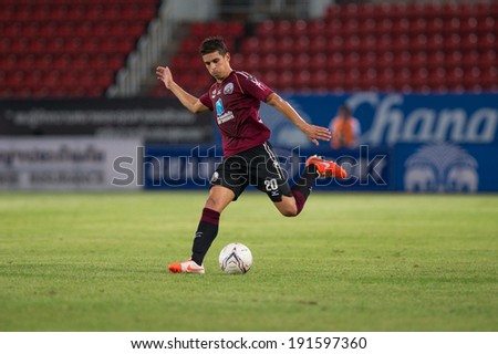 PATHUMTHANI THAILAND-MAY 05:Sergio Suarez of Police Utd.runs for the ball during  Thai Premier League match between Police Utd.and Songkhla Utd.at Thammasat Stadium on May 05,2014,Thailand