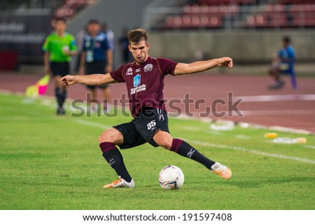 PATHUMTHANI THAILAND-MAY 05:Matej Rapnik of Police Utd.contols the ball during  Thai Premier League match between Police Utd.and Songkhla Utd.at Thammasat Stadium on May 05,2014,Thailand