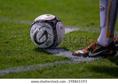 Nonthaburi THAILAND-Jun11:foot in close up of soccer cleats during the Toyota League Cup Big Bang Chula Utd and Muangthong Utd.at Nonthaburi Municipality Stadium on June 11,2014,Thailand