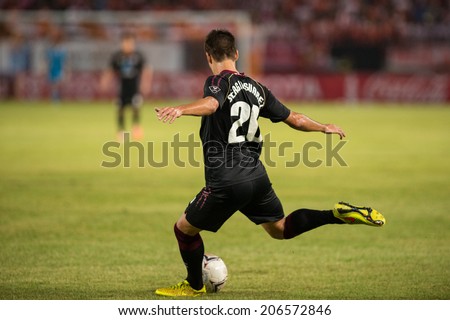 PATHUMTHANI THAILAND-Jul19:Sergio Suarez of Police Utd.hit the ball during  the Thai Premier League between Police United and Sisaket FC at Thammasat Stadium on July19,2014,Thailand