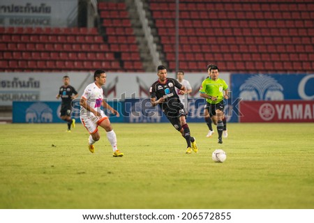 PATHUMTHANI THAILAND-Jul19:Michael Murcyof(B) Police Utd.in action during the Thai Premier League between Police United and Sisaket FC at Thammasat Stadium on July19,2014,Thailand