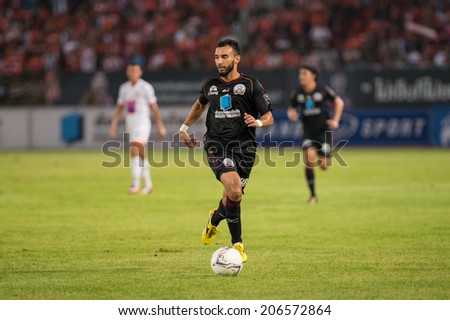 PATHUMTHANI THAILAND-Jul19:Adnan Barakat of Police Utd.contols the ball during  the Thai Premier League between Police United and Sisaket FC at Thammasat Stadium on July19,2014,Thailand