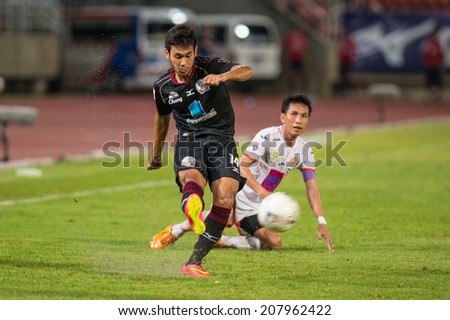 PATHUMTHANI THAILAND-Jul19:Pakorn Prempak(B) of Police Utd.hit the ball during  the Thai Premier League between Police United and Sisaket FC at Thammasat Stadium on July19,2014,Thailand