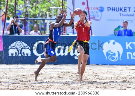 PHUKET,THAILAND-NOV 14:Tangpongpaiboon Anawin of Thailand during the gold medal Beach Flag Football Kuwait and Thailand during the 2014 Asian Beach Games at Saphan Hin on NOVEMBER 14,2014 in Thailand.