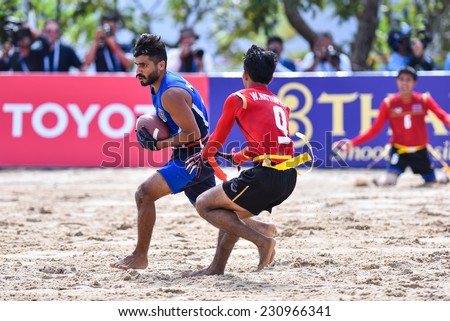 PHUKET,THAILAND-NOV14:Abdullah Dawoud of Kuwait during the gold medal Beach Flag Football Kuwait and Thailand during the 2014 Asian Beach Games at Saphan Hin on NOVEMBER 14,2014 in Thailand.