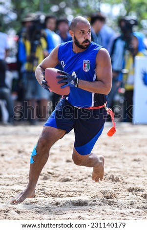 PHUKET,THAILAND-NOV14:Mohammad Bader of Kuwait run with the ball during the Beach Flag Football Kuwait and Thailand during the 2014 Asian Beach Games at Saphan Hin on NOVEMBER14,2014 in Thailand.
