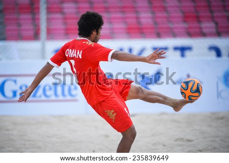 PHUKET THAILAND-NOV19:AL ARAIMI Mandhar Hilal Hamed of Oman kicks the ball during Beach Soccer match between Oman and Vietnam the 2014 Asian Beach Games at Saphan Hin on November19,2014 in Thailand