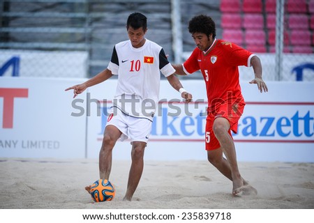 PHUKET THAILAND-NOV19:BUI Tran Tuan Anh (W) of Vietnam controls the ball during the Beach Soccer match between Oman and Vietnam the 2014 Asian Beach Games at Saphan Hin on November19,2014 in Thailand