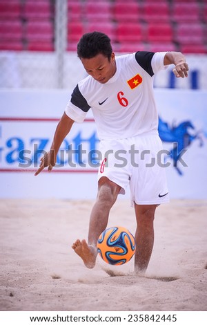 PHUKET THAI-NOV19:HUYNH Ngoc Cuong of Vietnam kicks the ball during the Beach Soccer match between Oman and Vietnam the 2014 Asian Beach Games at Saphan Hin on November19,2014 in Thailand