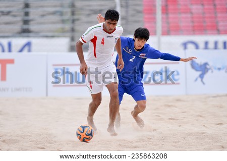 PHUKET THAI-NOV19:Mehdi Hassaninozari(W)of Iran in action during the Beach Soccer match between Iran and Thailand the 2014 Asian Beach Games at Saphan Hin on November19,2014 in Thailand