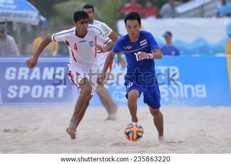 PHUKET THAILAND-NOV19:Komkrit Nanan of Thailand run with the ball during the  Beach Soccer match between Iran and Thailand the 2014 Asian Beach Games at Saphan Hin on November19,2014 in Thailand