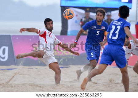 PHUKET THAI-NOV19:Mohammad Ahmadzadeh(W)of Iran hit the ball during the Beach Soccer match between Iran and Thailand the 2014 Asian Beach Games at Saphan Hin on November19,2014 in Thailand