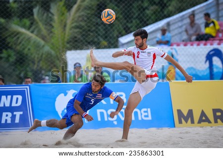 PHUKET THAILAND-NOV19:Amir Hosein Akbari Fartkhouni(W)of Iran kicks during  the Beach Soccer match between Iran and Thailand the 2014 Asian Beach Games at Saphan Hin on November19,2014 in Thailand