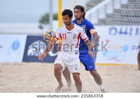 PHUKET THAI-NOV19:Mohammad Ahmadzadeh(W)of Iran controls the ball playing during Beach Soccer match between Iran and Thailand the 2014 Asian Beach Games at Saphan Hin on November19,2014 in Thailand