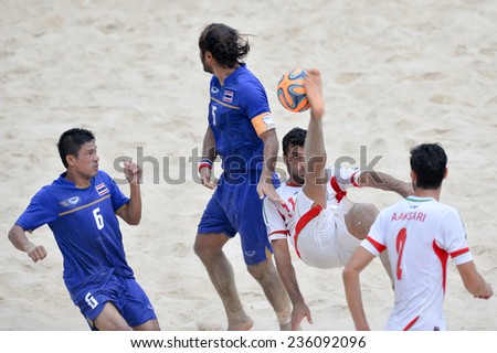 PHUKET THAILAND-NOV19:Mohammad Ahmadzadeh(W)of Iran kicks the ball during the Beach Soccer match between Iran and Thailand the 2014 Asian Beach Games at Saphan Hin on November19,2014 in Thailand
