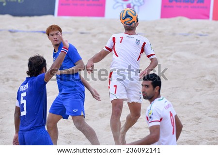 PHUKET THAILAND-NOV19:Shahriar Mozhdeh Roudsari(W)of Iran heads the ball during the Beach Soccer match between Iran and Thailand the 2014 Asian Beach Games at Saphan Hin on November19,2014 in Thailand