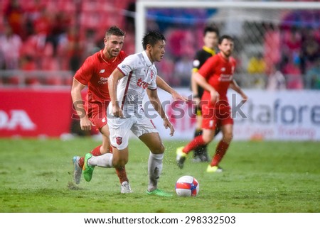 BANGKOK THAILAND JULY 14:Patipan Petpool(W)of Thai All Stars contols the ball during the international friendly match Thai All Stars and Liverpool FC at Rajamangala Stadium on July 14,2015 in,Thailand