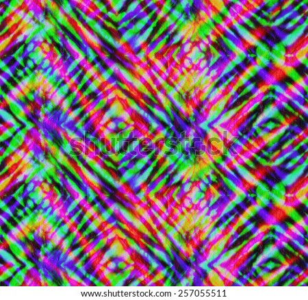 seamless tie dye pattern. colorful layered neon stripes, checks and rhombus. geometric tie dye pattern.