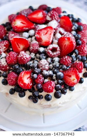 Egg whites sponge cake with cream and berries