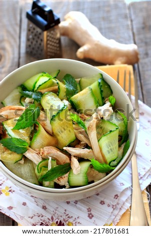 Oriental salad with cucumber and chicken with mint, ginger and soy sauce
