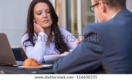 Businessman and businesswomen having a meeting in cafe.