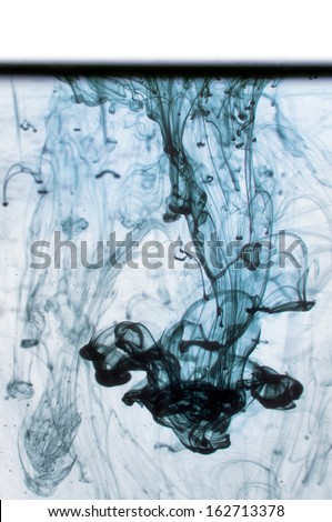 Blue ink in water on a white background.