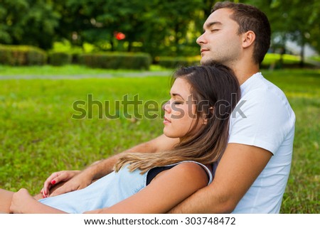 Couple fall asleep while picnic in park