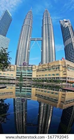 KUALA LUMPUR, MALAYSIA - 16 December 2013 - The reflection of double decker skybridge linking Tower 1 and Tower 2 of the Petronas Twin Towers. It is the highest 2-story bridge in the world