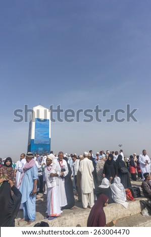 MECCA, SAUDI ARABIA - MAR 11: Muslims at Mount Arafat (or Jabal Rahmah) March 11, 2015 in Arafat, Saudi Arabia. This is the place where Adam and Eve met after being overthrown from heaven.