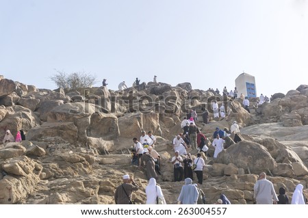 MECCA, SAUDI ARABIA - MAR 11: Muslims at Mount Arafat (or Jabal Rahmah) March 11, 2015 in Arafat, Saudi Arabia. This is the place where Adam and Eve met after being overthrown from heaven.