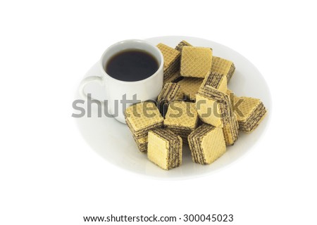 A cup of coffee and wafer cubes