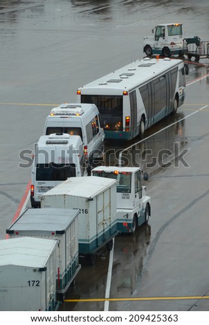 MOSCOW - CIRCA SEPTEMBER 2013: Vehicles of various airport services awaits for passage in Domodedovo Int., Moscow, Sept. 2013. Because of the high airfield activity, sometimes are happen traffic jams.