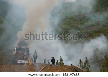 LIJIANG, CHINA - SEPTEMBER 19: Cremation ceremony of Mosuo Minority People on September 19, 2013, Yongning, Linlang, Lijiang, China