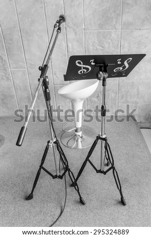 Music stage or singing background, microphone,chair made with black and white color.