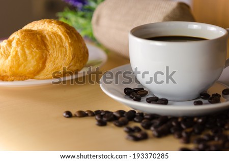 Coffee and bread on the table