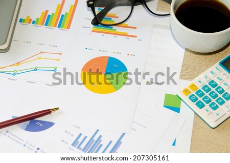 Financial papers, book and office supplies closeup