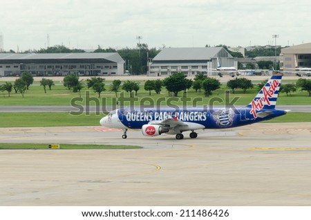 BANGKOK, THAILAND-AUGUST 9, 2014: Airplane parking on Bangkok International Airport (Don Muang) Bangkok,Thailand. August 9 2014.Air Asia Airways